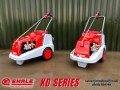 A pair of KD1140 Ehrle Cold Water Pressure Washers with red covers on a blurred background.